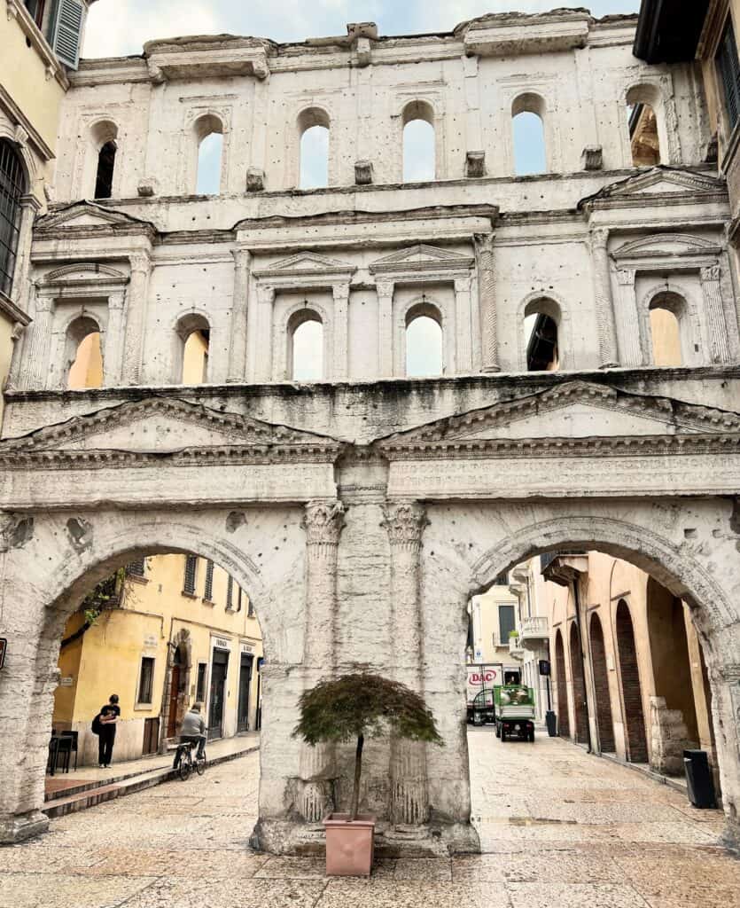 Verona Porta Borsari Ancient Roman Gateway Columns Pediments Man On Bicycle