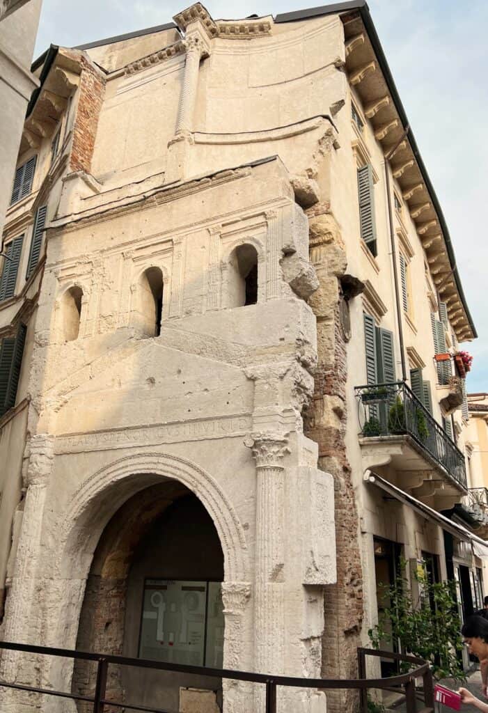 Porta Leoni Verona Ancient Roman Gate With Arch Columns And Modern Buildings