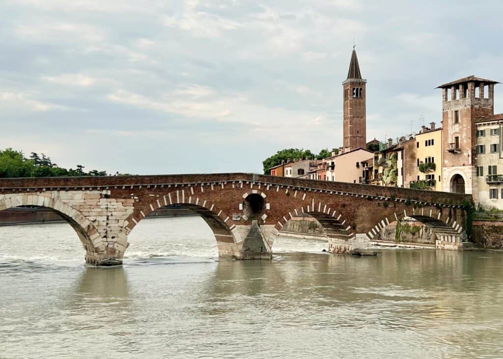 Verona Ponte Pietra Roman Bridge With Medieval Towers In Background