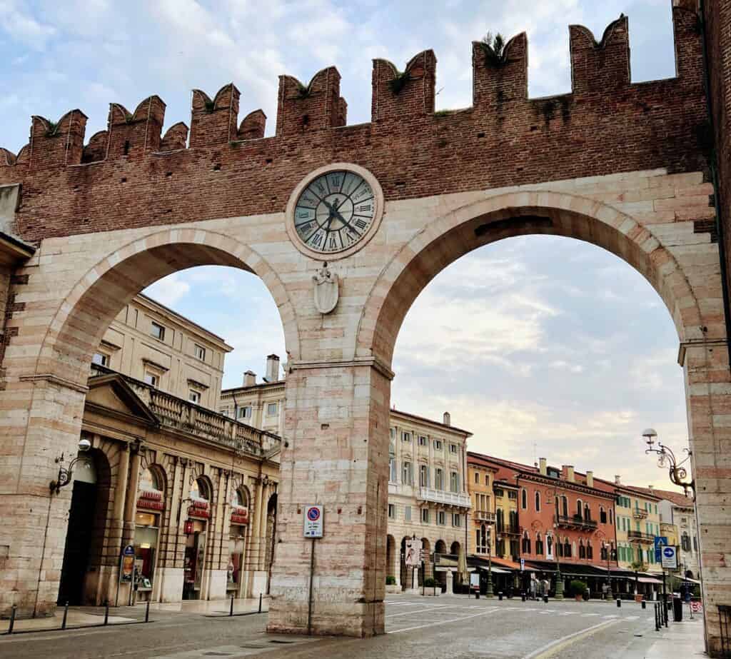 Verona Portoni Gate Pink Marble Stripes And Brick Crenellations With Clock Gateway to Piazza Bra
