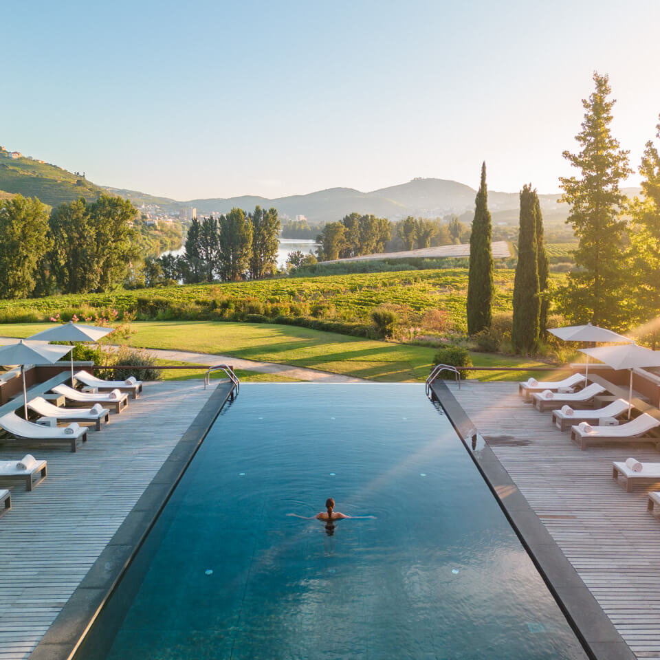 six senses Douro valley infinity pool with sunrise view over the vineyards