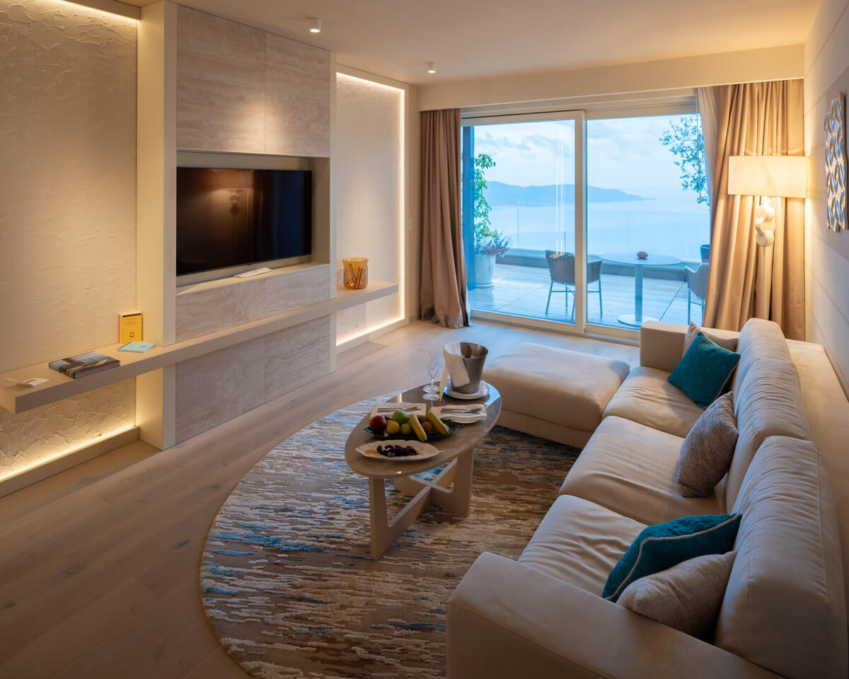 the living room with cozy sofa at the sky suite of the Lefay Resort & Spa Lago di Garda in Italy
