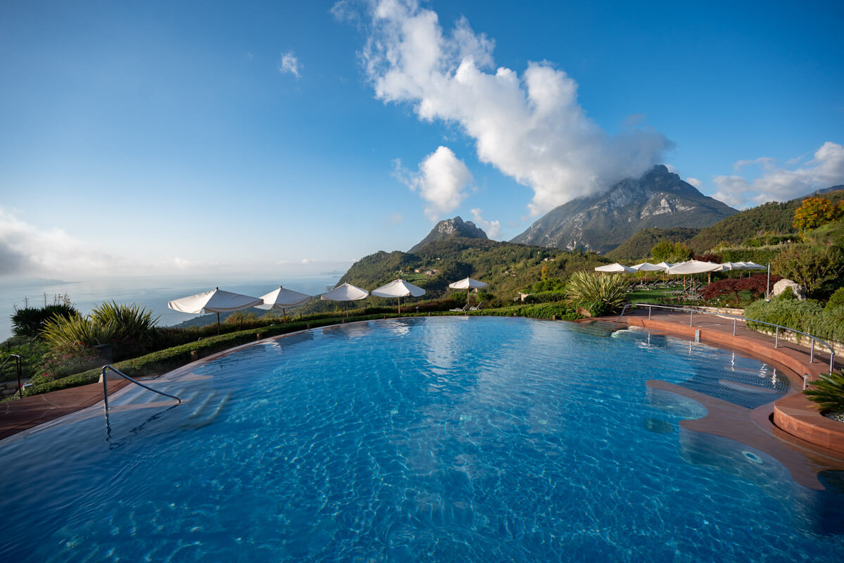 the blue wellness pool at the Lefay Resort & Spa Lago di Garda in Italy, overlooking the mountains