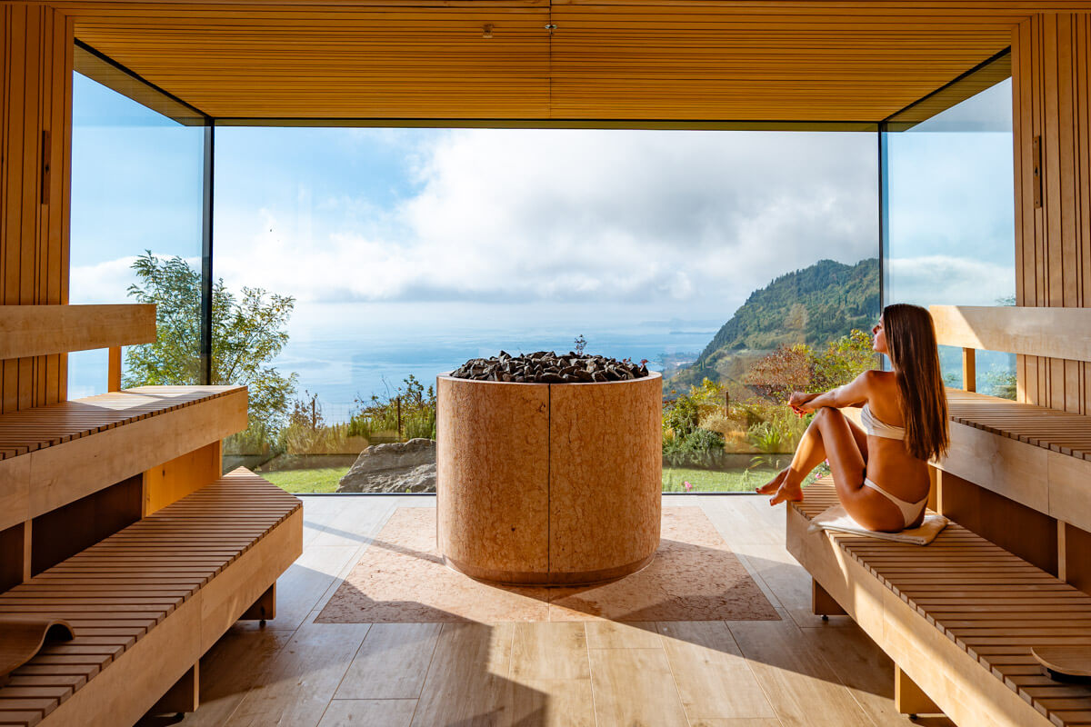 a Panorama glass sauna overlooking the scenery of lake Garda in Italy, the sauna is located in the hotel Lefay Resort & Spa Lago di Garda in Italy #