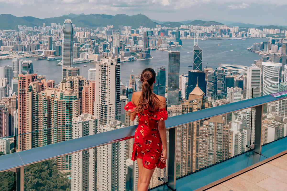 standing on a platform at Victoria Peak, Overlooking the skyline of Hong Kong