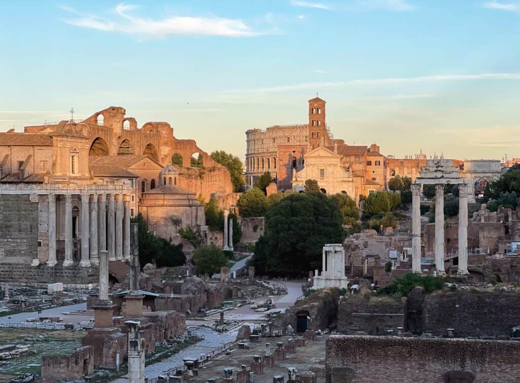 View Of Roman Forum And Colosseum At Sunset