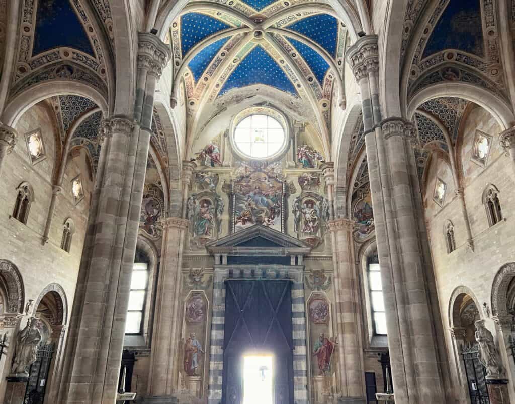 Pavia Certosa Church Interior Front Entrance View Nave With Blue Ceiling Frescoes Stone Columns Late Gothic Architecture